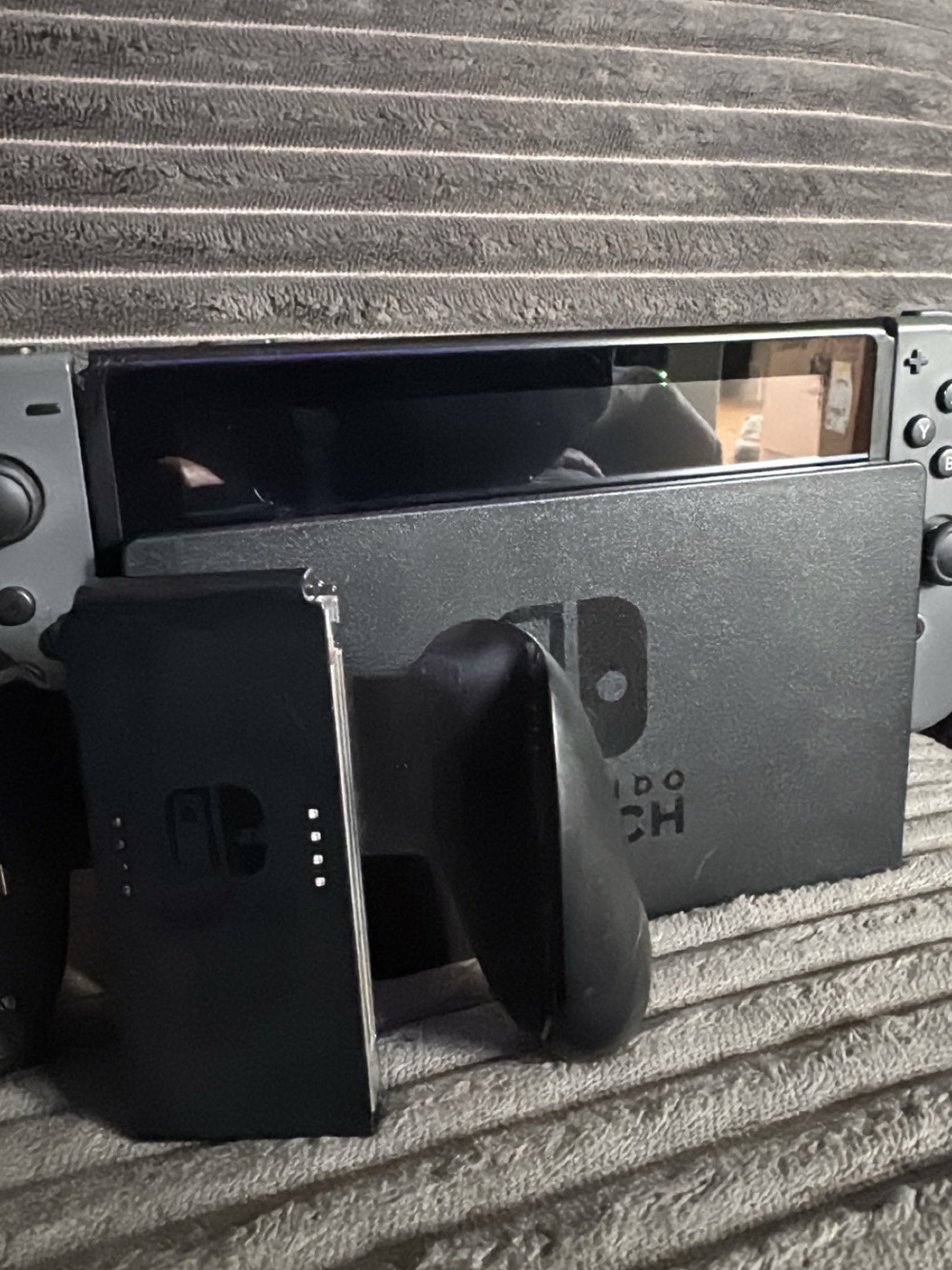 Nintendo Switch Console with Gray Joy‑Con and Black Dock